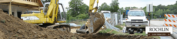 A man on a backhoe digging a hole.